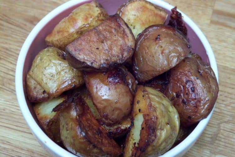 Roasted chicken and potatoes in a round bowl