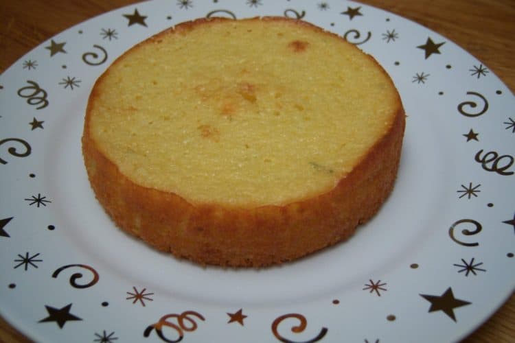 Orange Yogurt Muffins on small white plate with gold stars and swirls