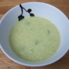Broccoli Cheese Soup in round white bowl with black flowers