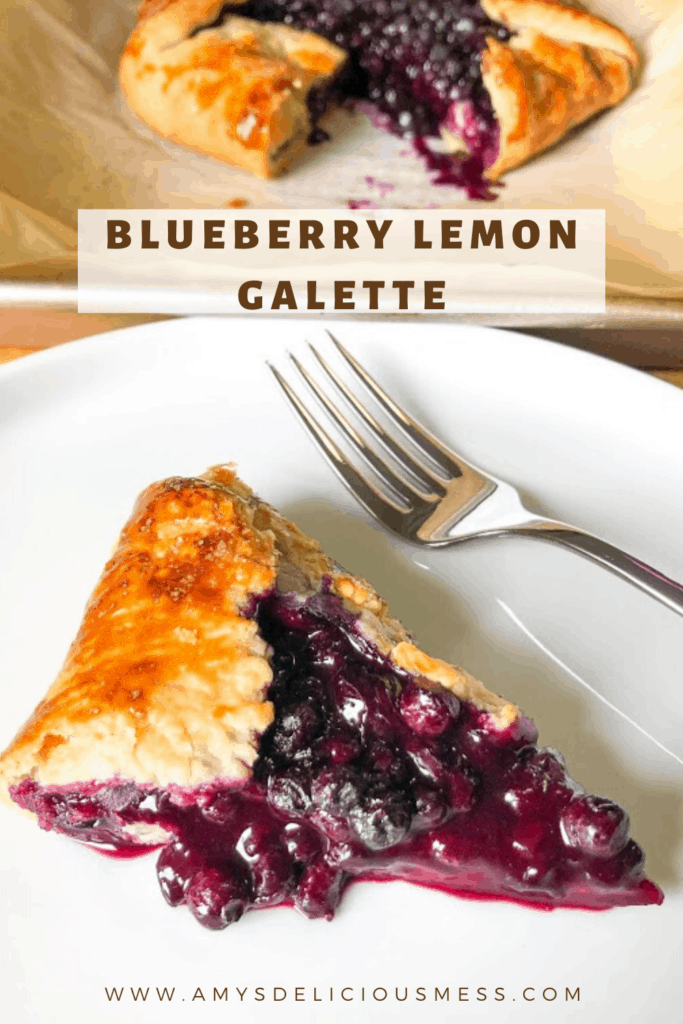 Blueberry lemon galette slice on round white plate with fork, blueberry lemon galette on parchment lined sheet pan in background