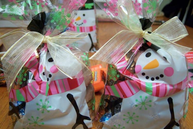 Goodie bags plastic bags with snowman design tied close with ribbon