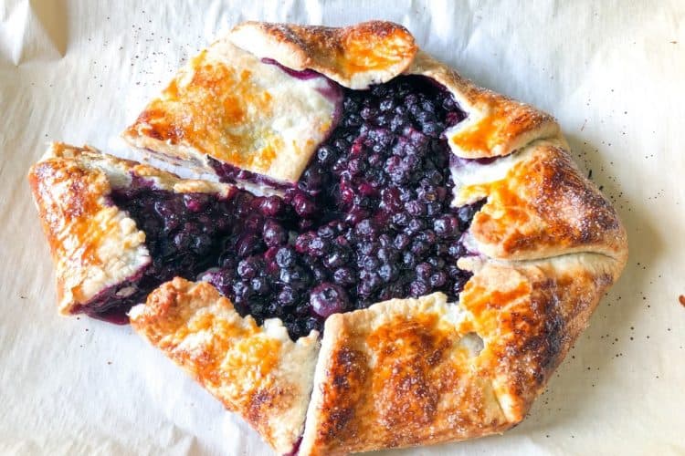 easiest blueberry lemon galette baked on parchment paper