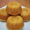 Savory corn muffins on small white square plate