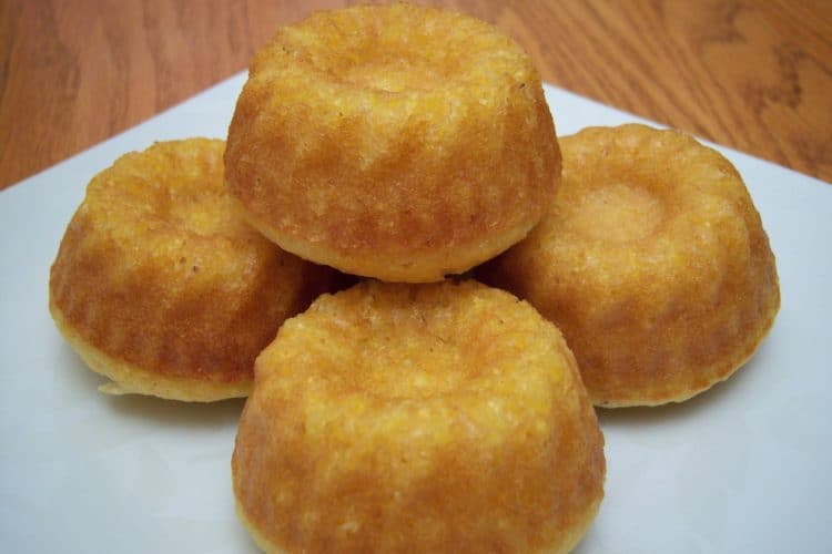 Savory corn muffins on small white square plate