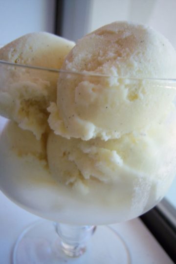 Vanilla ice cream in mini trifle dish on window sill