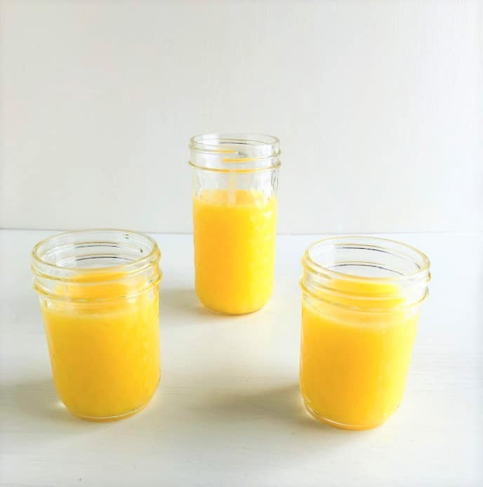 Three mason jars filled with lemon curd